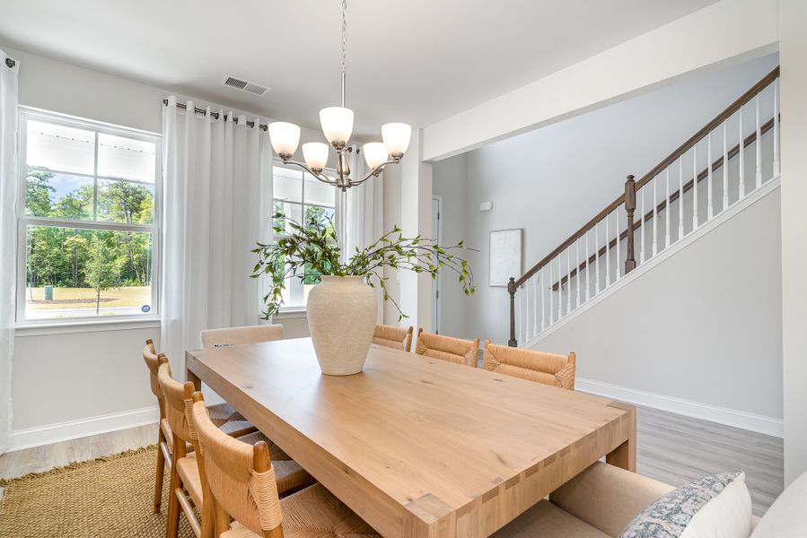 Furnished interior in a model home at Waterbridge in Myrtle Beach (Image 62).