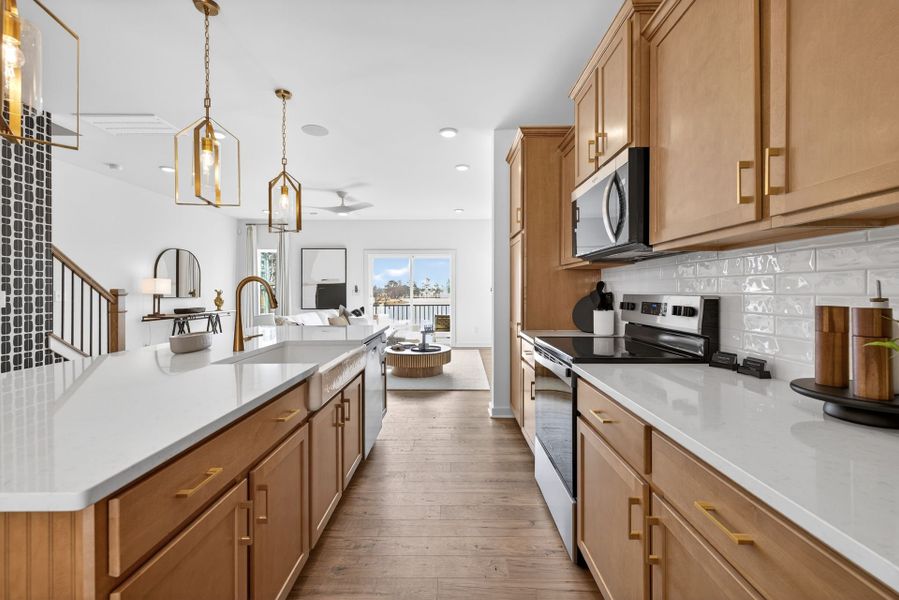 Furnished interior in a model home at North District at Flowers Plantation Townhomes in Clayton (Image 5).