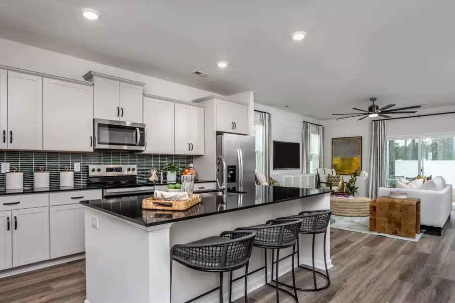 Furnished interior in a model home at Coastal Haven Townes in Leland (Image 2).