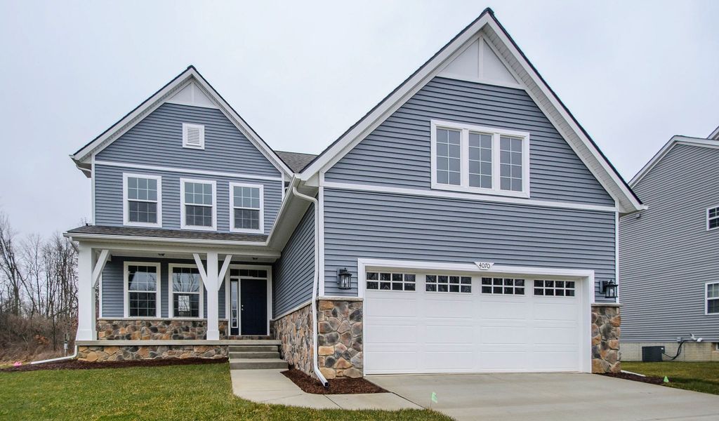 Front exterior of a home in the Preserve at Magnolia Park community, located in Jackson, MI (Image 9). Front exterior of a home in the Preserve at Magnolia Park community, located in Jackson, MI (Image 9).