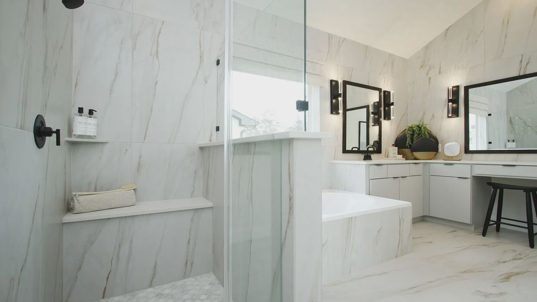 Revel in marble elegance and modern fixtures in Woodlands Hills' sophisticated bathroom design.