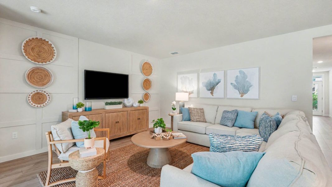 Furnished interior in a model home at Indian River Preserve in Mims (Image 13).