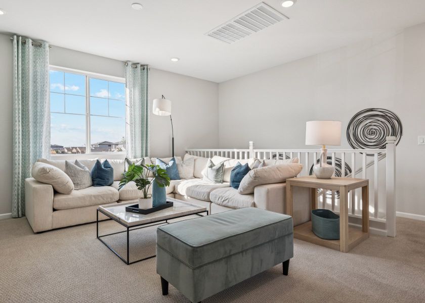 A living room with a couch and a coffee table.