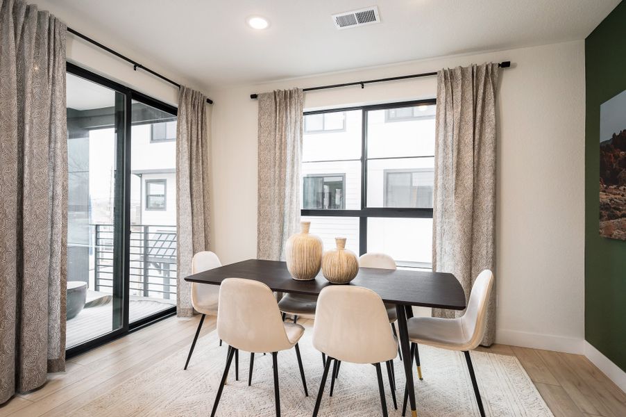 Furnished interior in a model home at The Hub at Virginia Village in Denver (Image 9).
