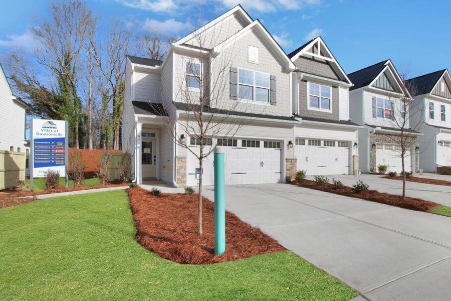 Front exterior of a home in the Villas at Dawsonville Townhomes community, located in Dawsonville, GA (Image 4). Front exterior of a home in the Villas at Dawsonville Townhomes community, located in Dawsonville, GA (Image 4).