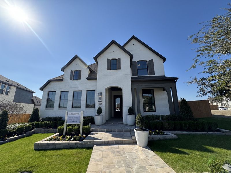 A stylish white brick home with elegant shutters and manicured landscaping in Weston Oaks by Highland Homes (San Antonio, TX). A stylish white brick home with elegant shutters and manicured landscaping in Weston Oaks by Highland Homes (San Antonio, TX).