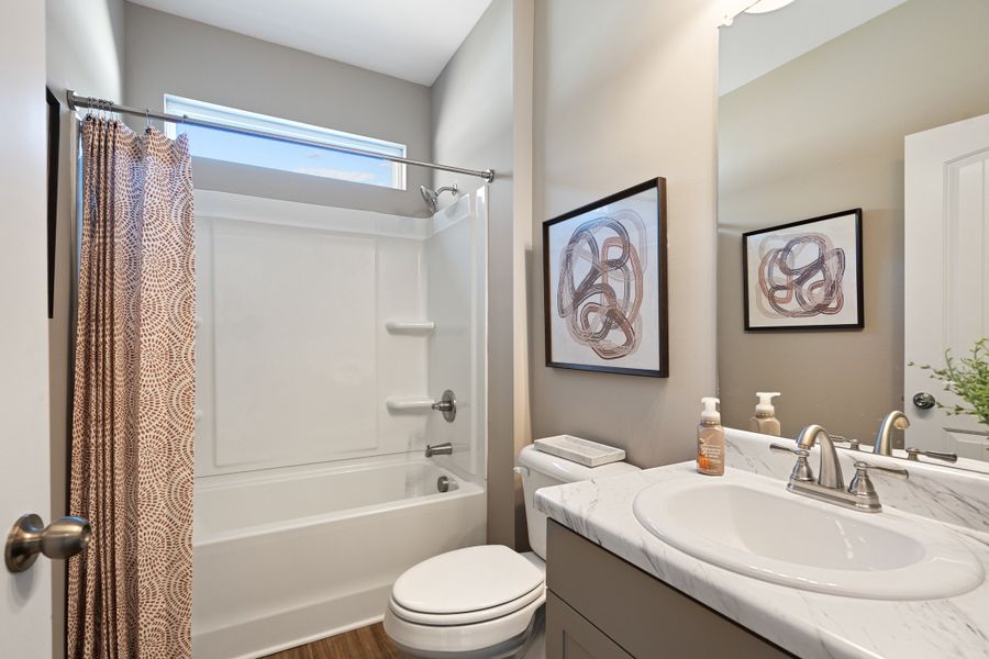 Furnished interior in a model home at Vandiver Creek in South Fulton (Image 6).