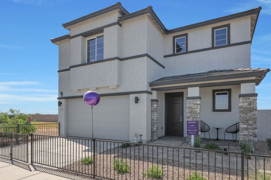 A house with a fence in front. A house with a fence in front.