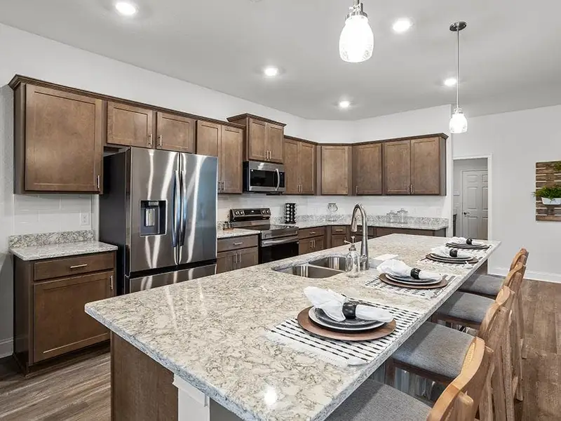 Enjoy a luxuriously-appointed kitchen - Waylyn model home in St. Cloud, FL