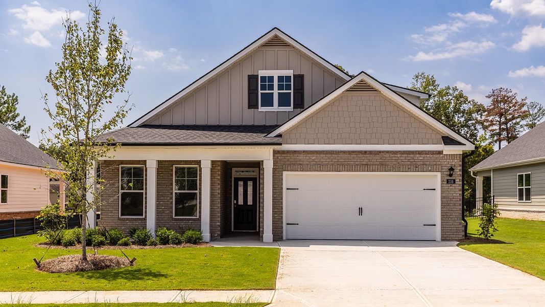 Front exterior of a home in the Oak Ridge Meadows - Active Adult community, located in Locust Grove, GA (Image 4).