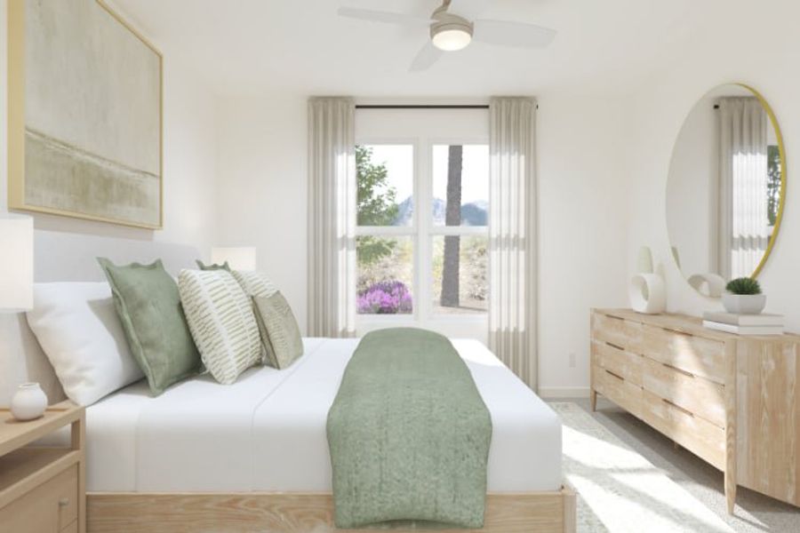 A room with a bed and a mirror.