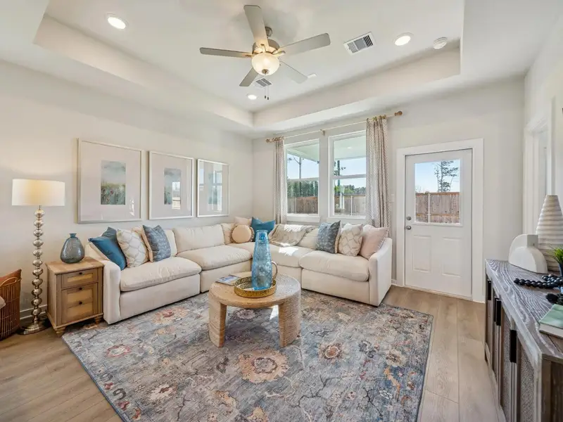 Furnished interior in a model home at Spring Branch Crossing in Conroe (Image 6).