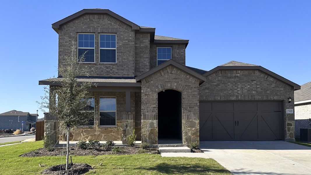 Front exterior of a home in the Northspur community, located in Forney, TX (Image 1).