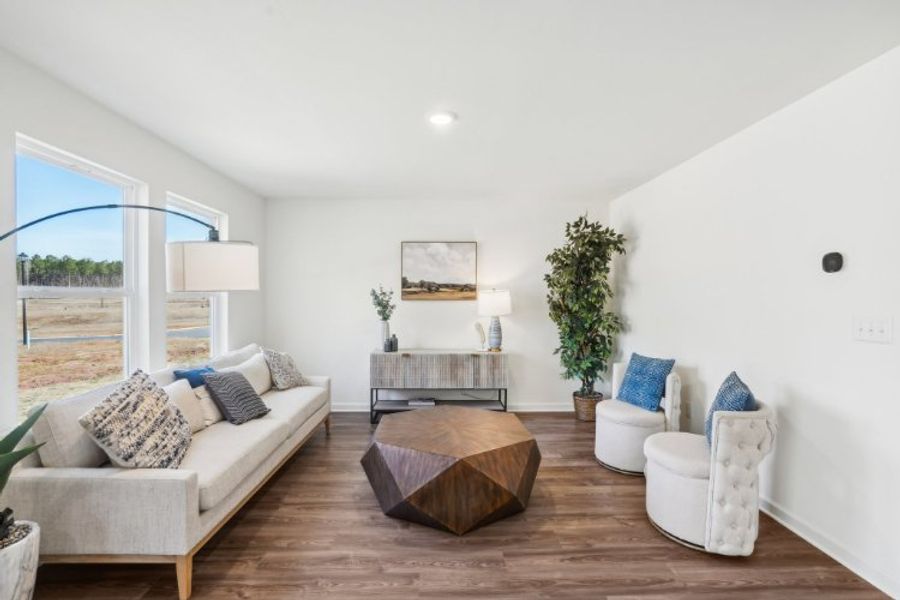 A living room with a large glass door.