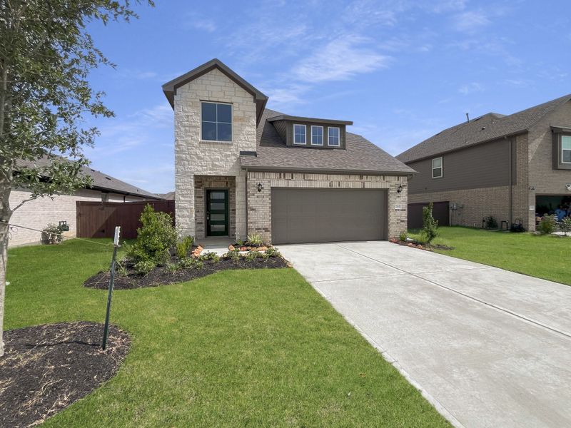 Front exterior of a home in the Southwinds community, located in Mont Belvieu, TX (Image 9). Front exterior of a home in the Southwinds community, located in Mont Belvieu, TX (Image 9).