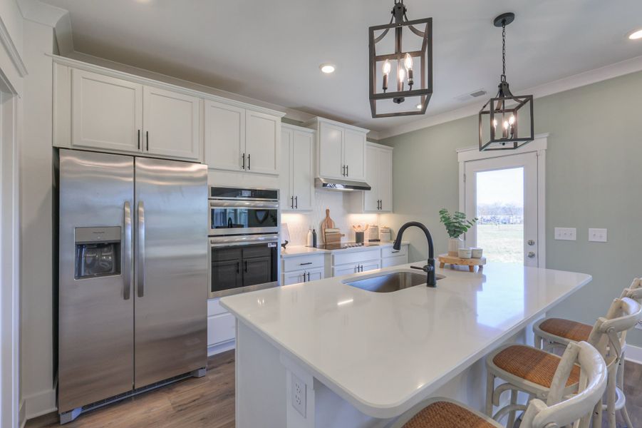 Furnished interior in a model home at Langford Farms in Gallatin (Image 33).
