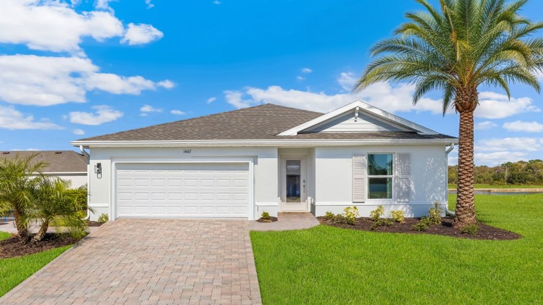 Front exterior of a home in the Avalon community, located in Lehigh Acres, FL (Image 3).