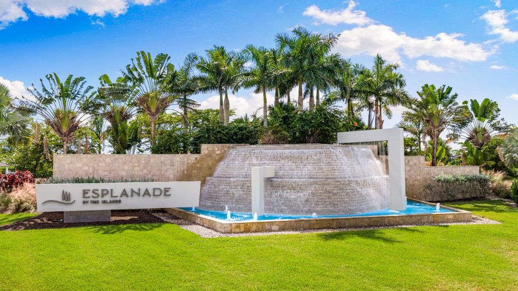 Entrance to the Esplanade by the Islands community in Naples, FL, featuring signage and landscaping (Image 1).