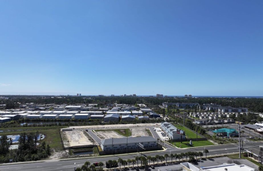 Aerial view of the Waypoint Townhomes community in Panama City Beach, FL, showing layout and nearby surroundings (Image 9).
