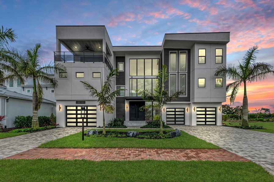 Front exterior of a home in the Legends Bay community, located in Bradenton, FL (Image 2).