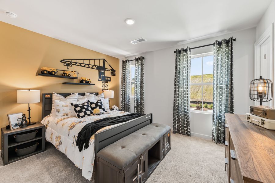 A bedroom with a bed and a bench. A bedroom with a bed and a bench.