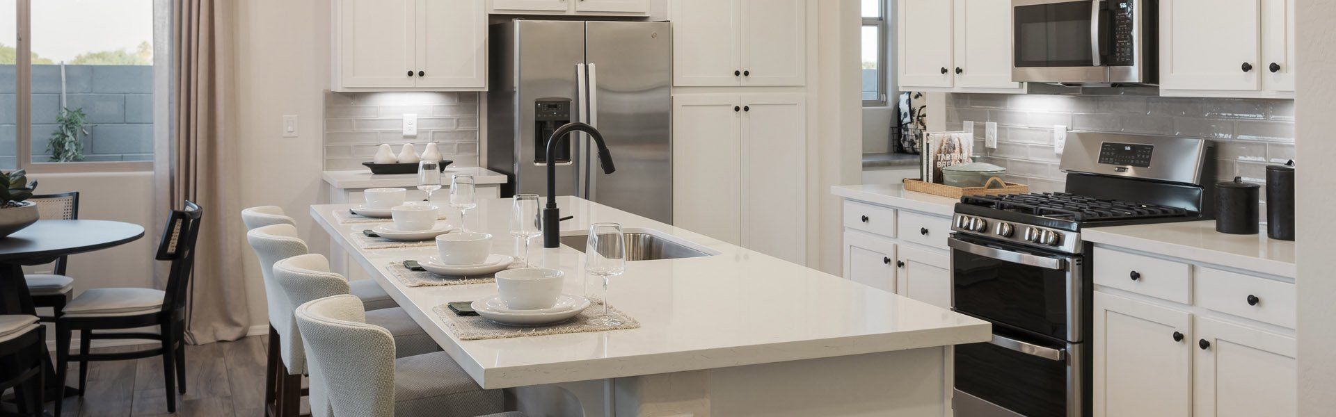 Furnished interior in a model home at Windrose V in Waddell (Image 9).