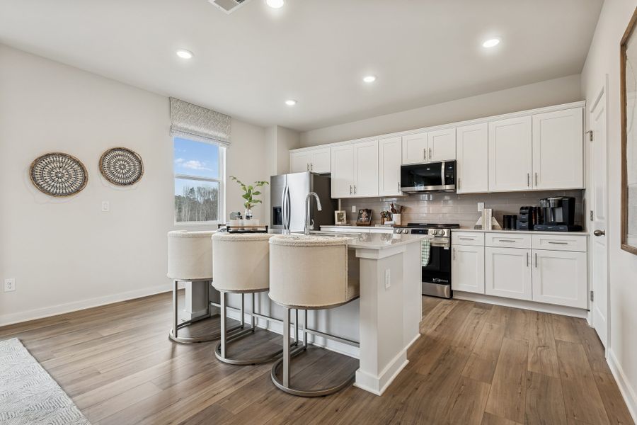 A kitchen with white cabinets. A kitchen with white cabinets.
