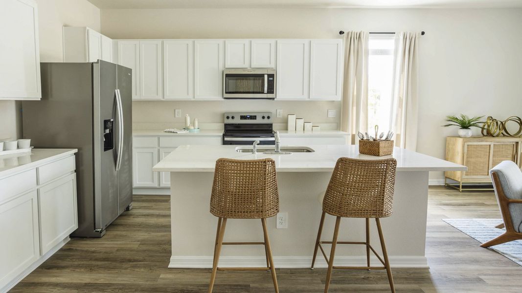 Furnished interior in a model home at Village Oaks in Clearwater (Image 5).