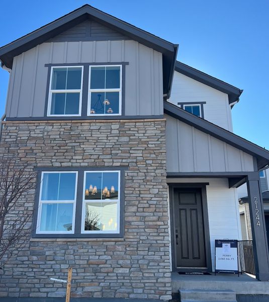 Charming home with stone facade and modern accents in Painted Prairie by Pulte Homes (Aurora, CO).