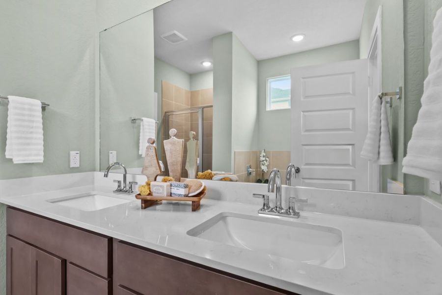 A bathroom with a large mirror. A bathroom with a large mirror.