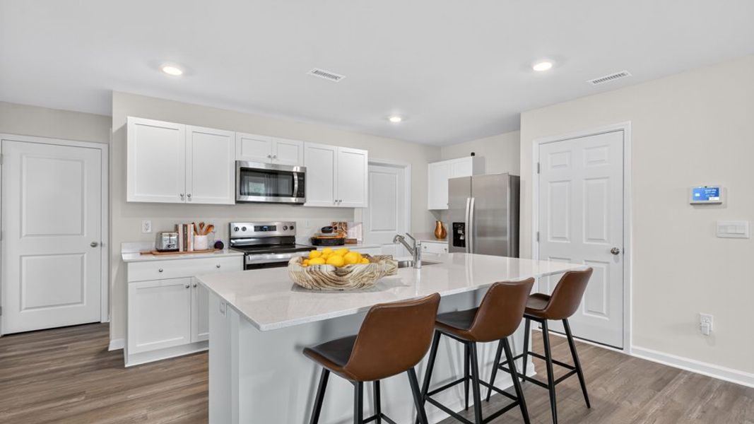 Furnished interior in a model home at Belle Grove in Wendell (Image 7).