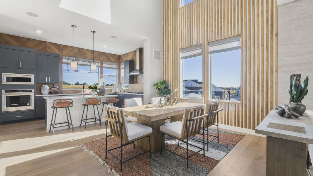 Elegant Dillon Pointe kitchen boasts vertical wood paneling and striking high ceilings. Elegant Dillon Pointe kitchen boasts vertical wood paneling and striking high ceilings.