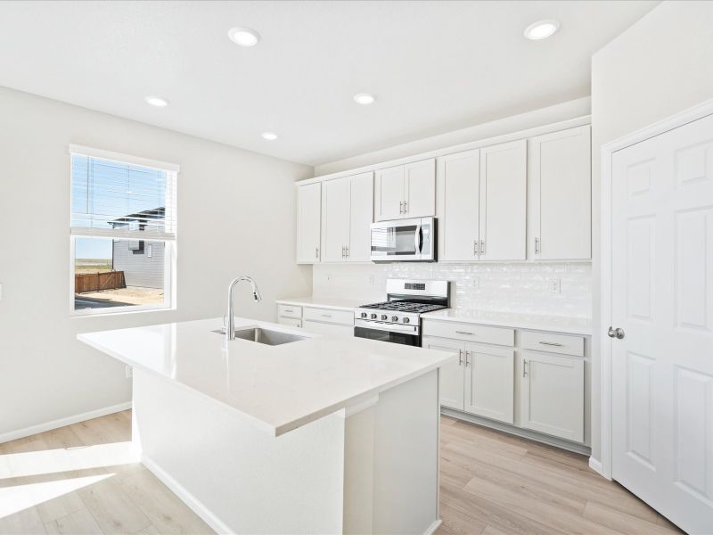 Furnished interior in a model home at Buffalo Highlands: The Flora Collection in Commerce City (Image 7).