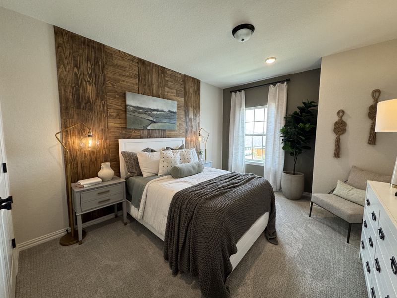 Cozy bedroom featuring a wood accent wall, elegant lighting, and soft neutral tones with plush bedding and stylish decor. Cozy bedroom featuring a wood accent wall, elegant lighting, and soft neutral tones with plush bedding and stylish decor.