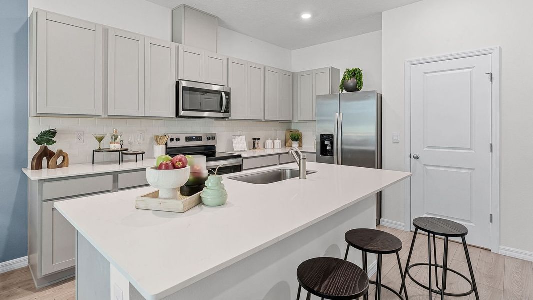 Furnished interior in a model home at Fish Lake Cove in Kissimmee (Image 17).