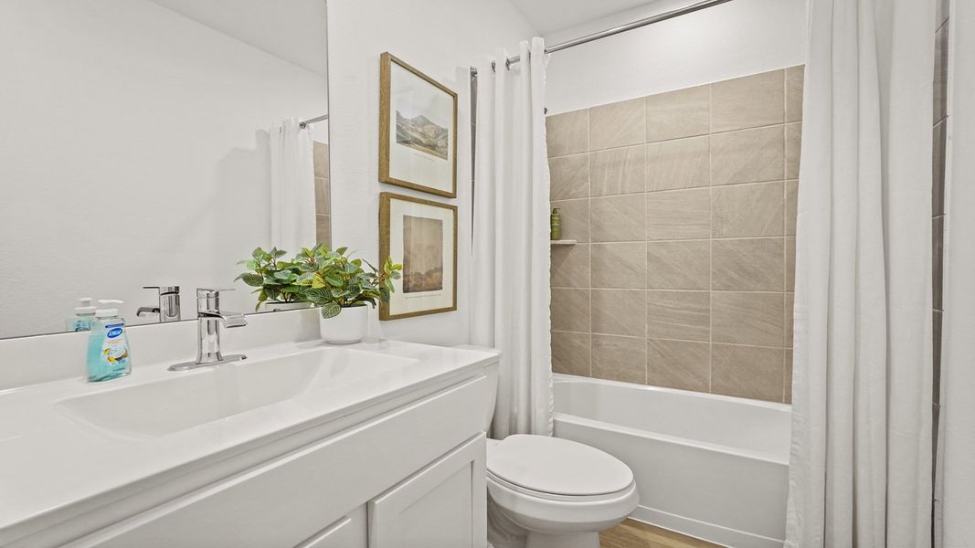 Furnished interior in a model home at Newport Pointe in Crosby (Image 9).