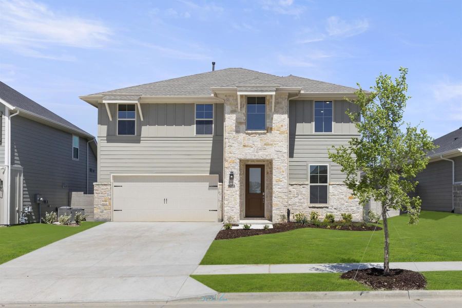 Front exterior of a home in the Painted Tree 50s community, located in McKinney, TX (Image 7).