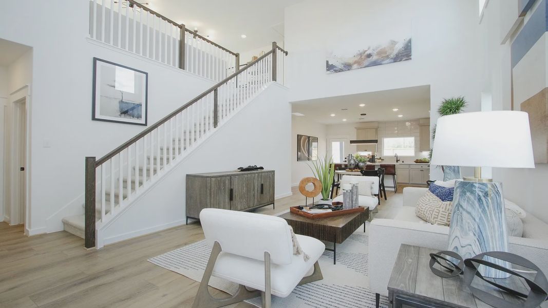 High ceilings, open staircase, and chic modern decor define luxury living in Pinehurst.