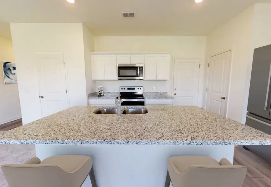 Furnished interior in a model home at Elm Park in Austin (Image 4).
