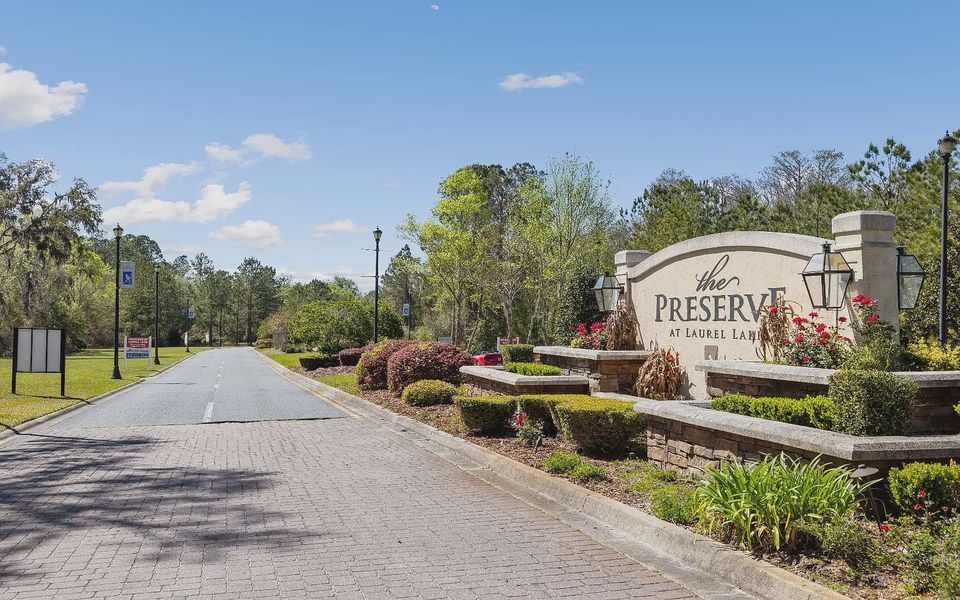 Entrance to the The Preserve at Laurel Lake community in Lake City, FL, featuring signage and landscaping (Image 11).