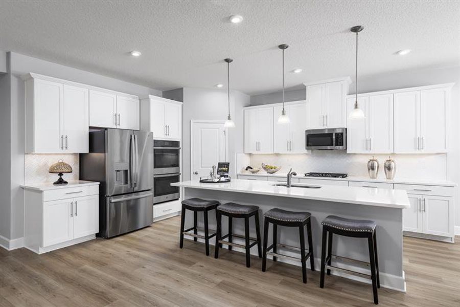 Dream kitchen with open layout and large island offer space to cook, gather, and entertain with ease Dream kitchen with open layout and large island offer space to cook, gather, and entertain with ease