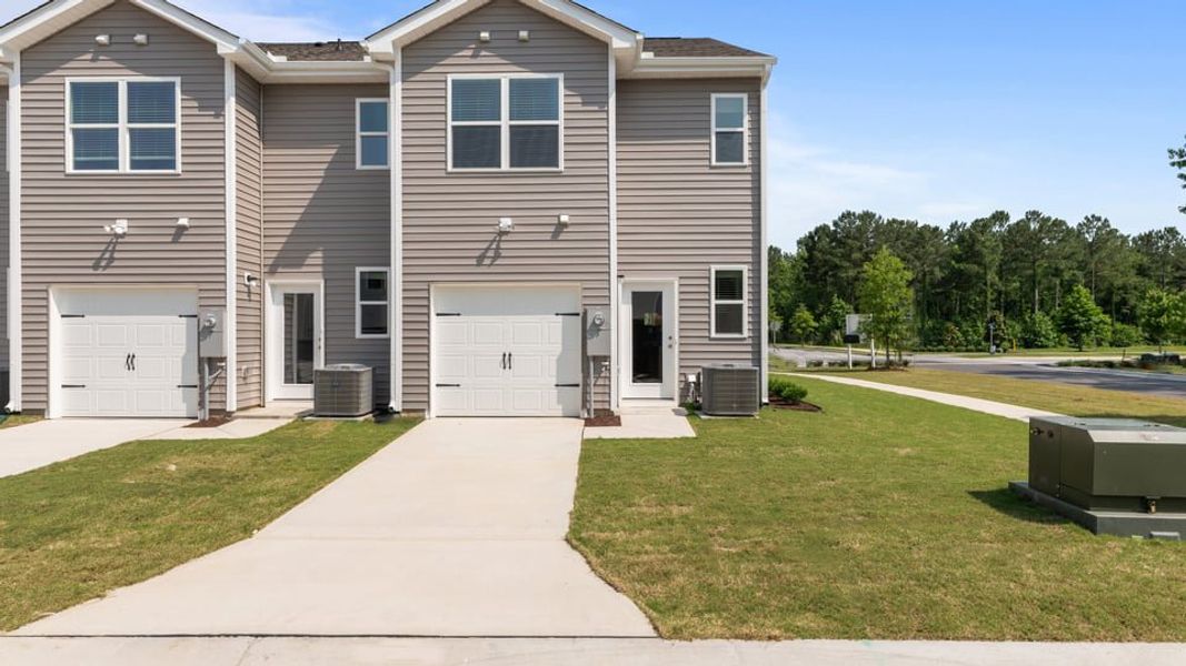 Front exterior of a home in the Clock Road Townhomes community, located in New Bern, NC (Image 12).