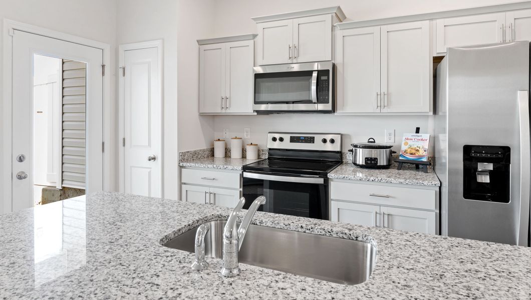 Furnished interior in a model home at Tanglewood Townes in Greenville (Image 8).