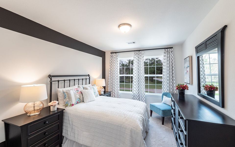 Furnished interior in a model home at Infinity Square in Kyle (Image 11).