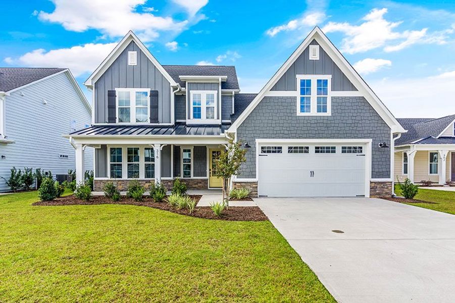 Front exterior of a home in the WyndWater community, located in Hampstead, NC (Image 21).