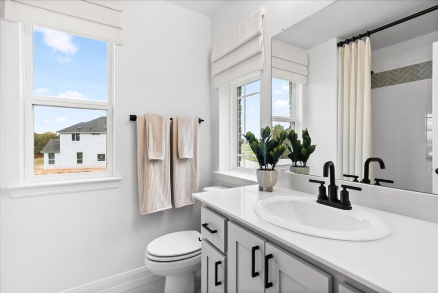 Furnished interior in a model home at The Reserve at Spiritas Ranch in Little Elm (Image 32).