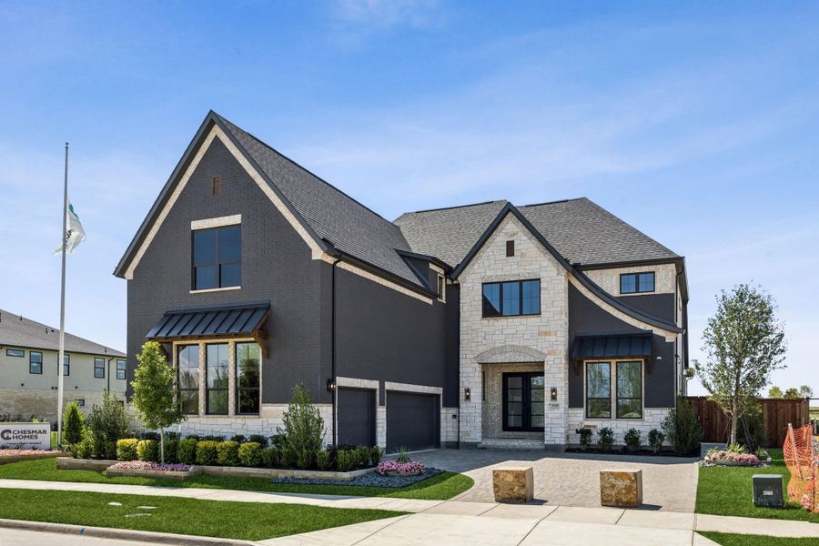 Front exterior of a home in the The Grove Frisco community, located in Frisco, TX (Image 2).