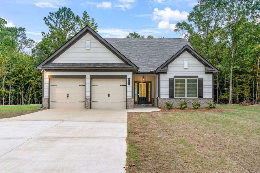 Front exterior of a home in the Waters Edge community, located in Mansfield, GA (Image 2).