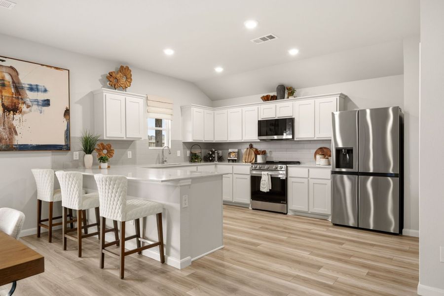 A kitchen with white cabinets. A kitchen with white cabinets.