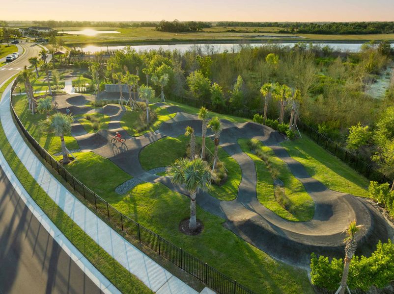Aerial view of the North River Ranch – Townhomes community in Parrish, FL, showing layout and nearby surroundings (Image 1).